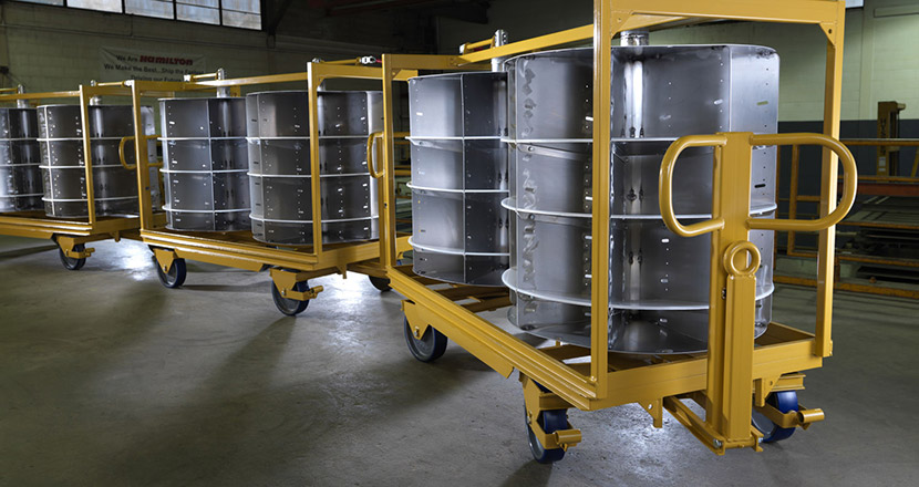 Auto supplier revs up engine production with 68 custom trailers.
